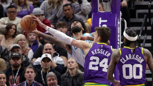 Feb 22, 2024; Salt Lake City, Utah, USA; Utah Jazz center Walker Kessler (24) blocks the shot of Charlotte Hornets center Nick Richards (4) after fouling him during the second quarter at Delta Center. Mandatory Credit: Chris Nicoll-USA TODAY Sports